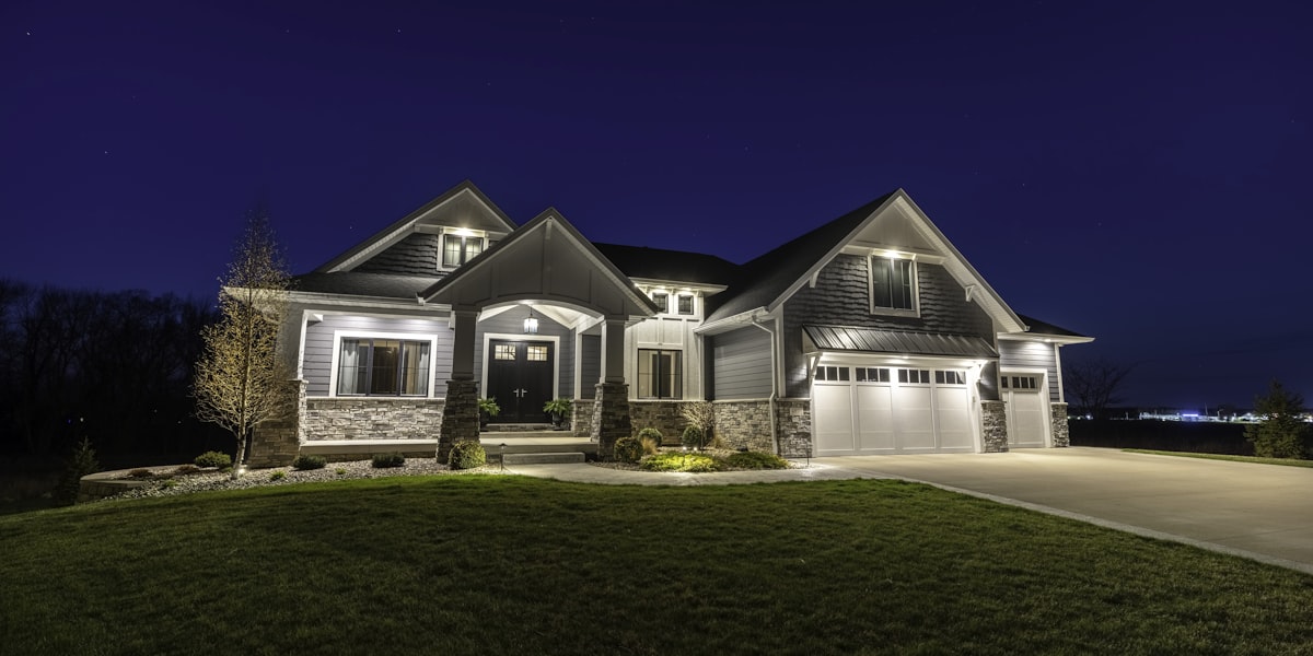 Beautifully lit residential home at night powered by reliable electrical systems